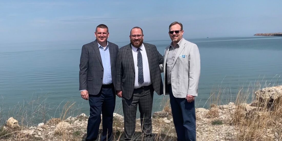 Ports of Indiana port director Ryan McCoy and CEO Jody Peacock welcome GLS Administrator Adam Tindall-Schlicht (middle)