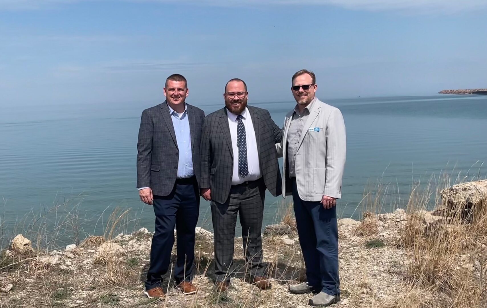 Ports of Indiana port director Ryan McCoy and CEO Jody Peacock welcome GLS Administrator Adam Tindall-Schlicht (middle)